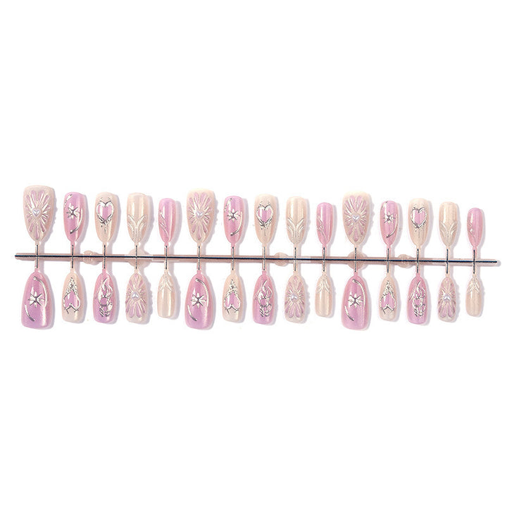 Acrylic nail set with floral accents and glitter embellishments Kalsten