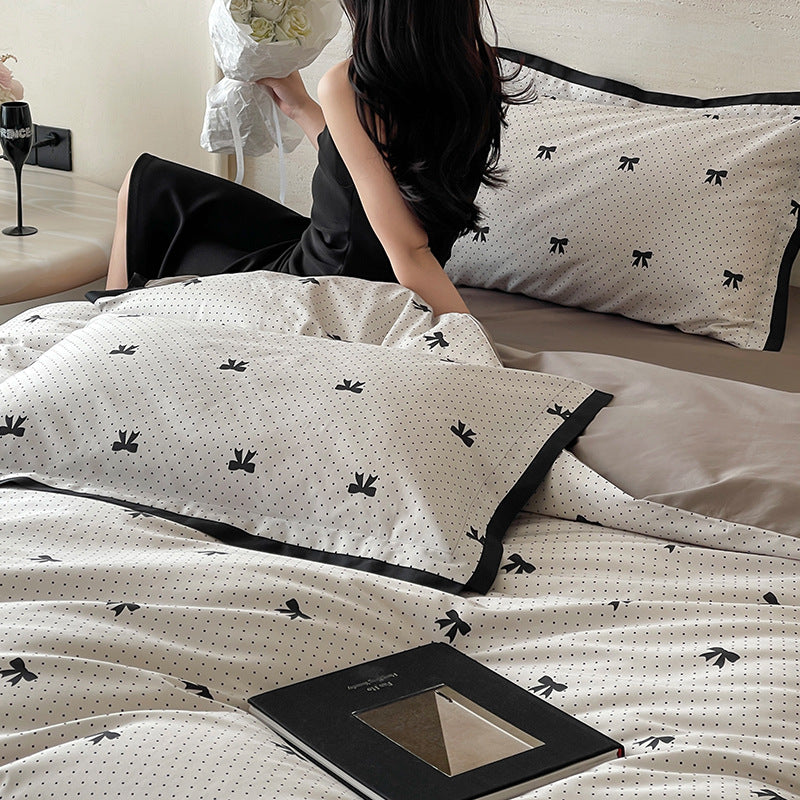 Luxurious cotton satin bedding set with butterfly motif and contrasting frame edge