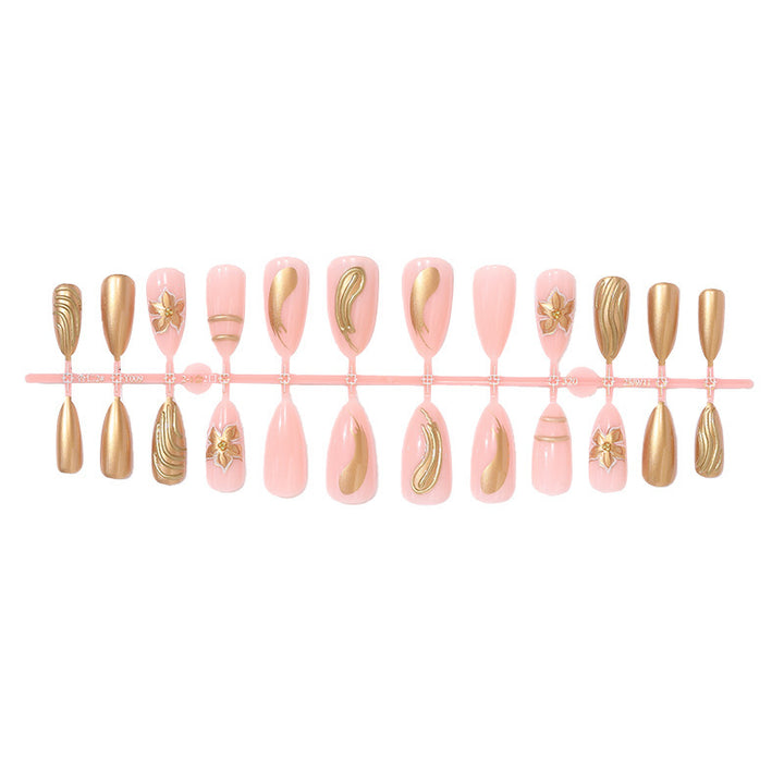 Creative nail art set with luxurious gold embellishments Kalsten