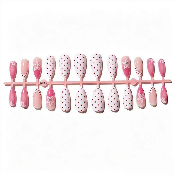 Artificial nail set with floral accents and charming polka dots Kalsten