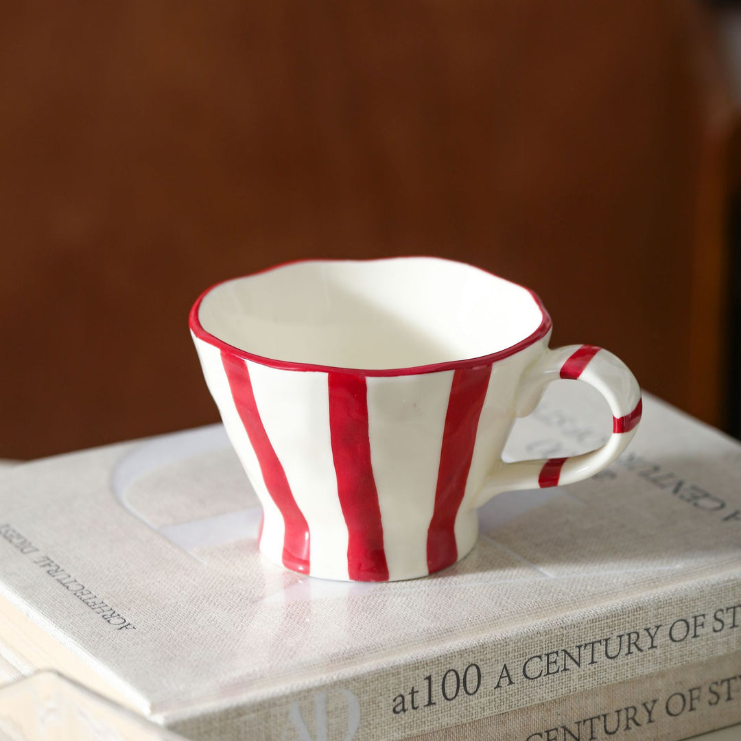 Designer stoneware coffee mug with scalloped rim and vertical brushstroke