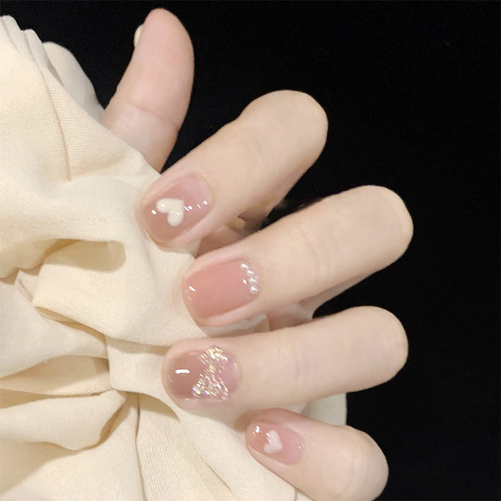 Artificial nails with romantic hearts and glitter accents Kalsten