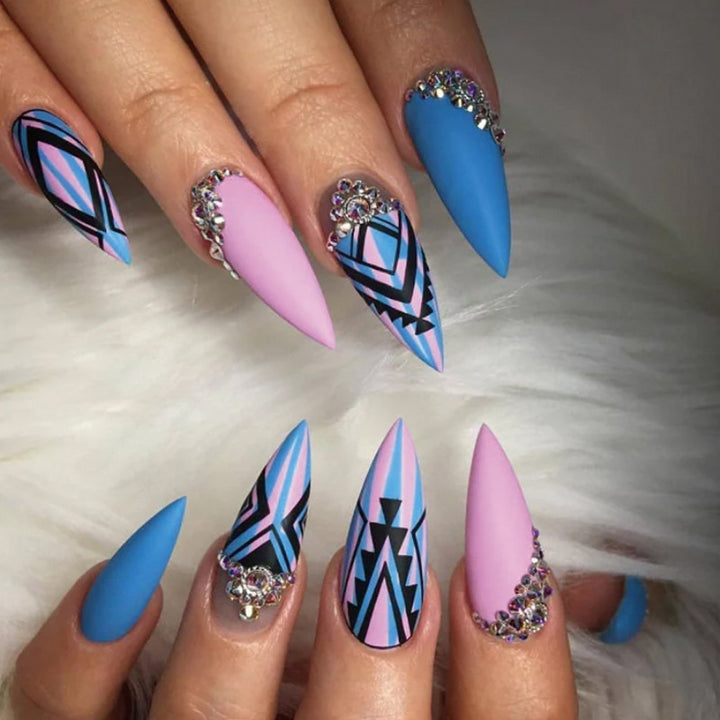 Artful stiletto nails with modern geometric designs and rhinestone embellishments Kalsten