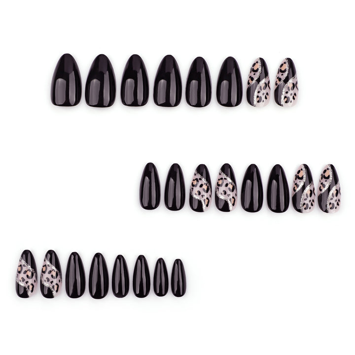 Artistic stiletto nails with leopard design and glitter effects Kalsten