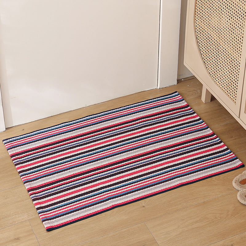 Striped cotton doormat with non-slip bottom and decorative woven edge Kalsten