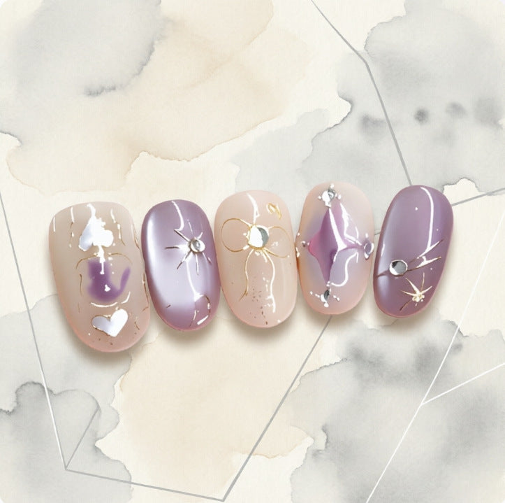 Artificial nails with playful bow and star design Kalsten