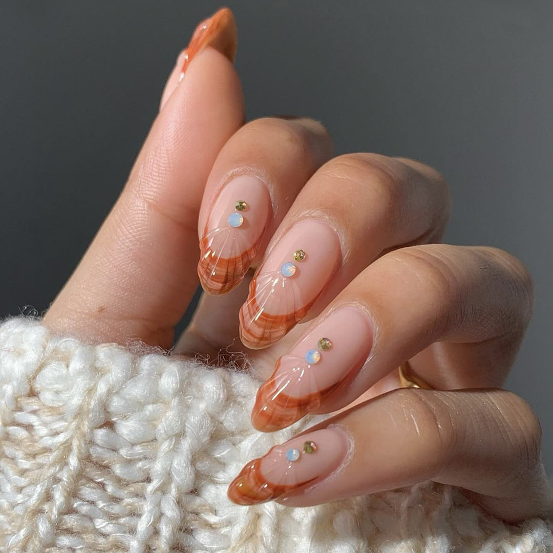 Acrylic nail set with curved tip style and glitter accents Kalsten
