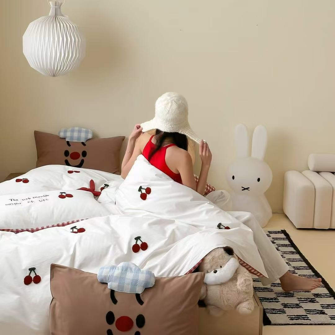 Children's bedding set with embroidered sprinkle appliqués, cuddle pillow and reversible function