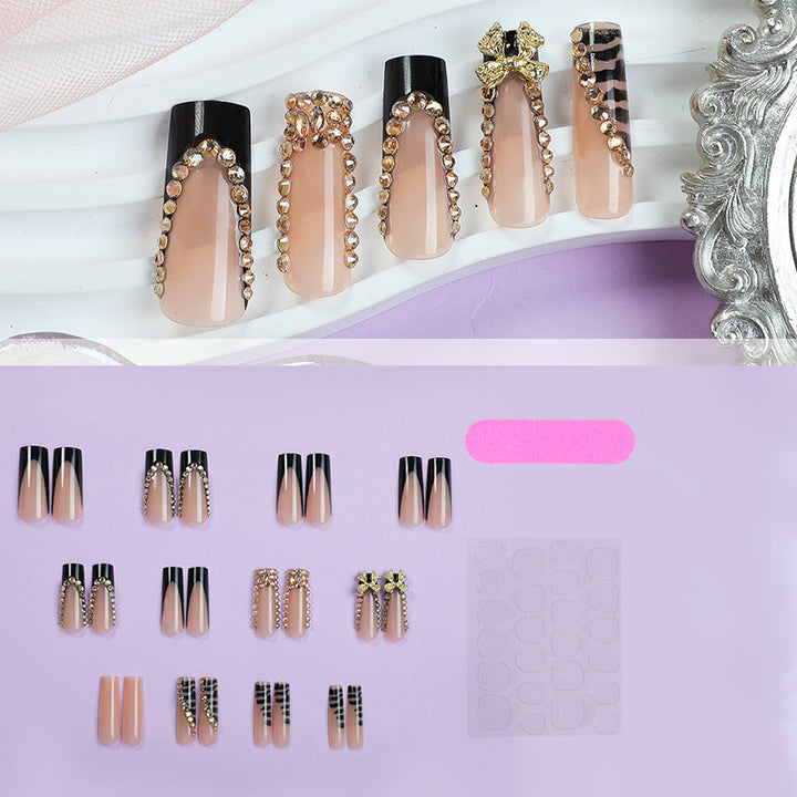 Acrylic nail set with glamorous 3D bows and radiant rhinestone decorations Kalsten