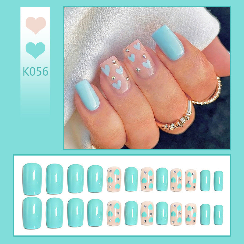 Nail art with heart designs and glitter accents Kalsten