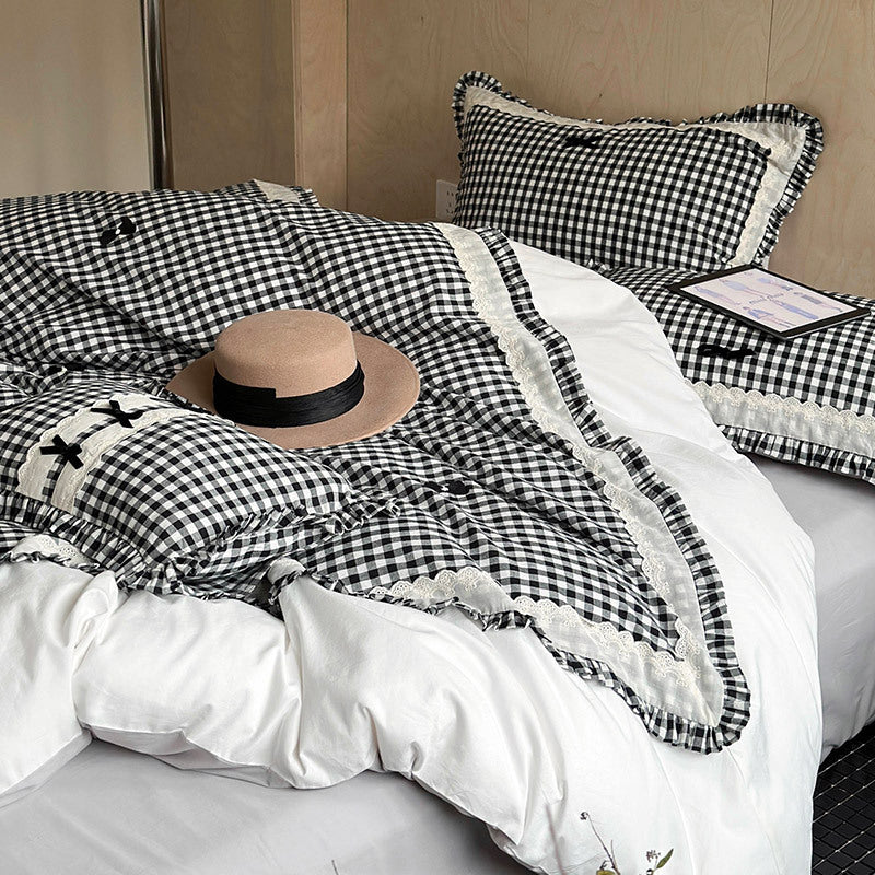 Bedding set in country house style with Vichy check, ruffle and embroidery appliqués