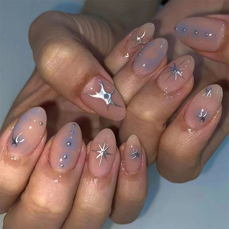 Elegant nail art with glamorous metal embellishments Kalsten
