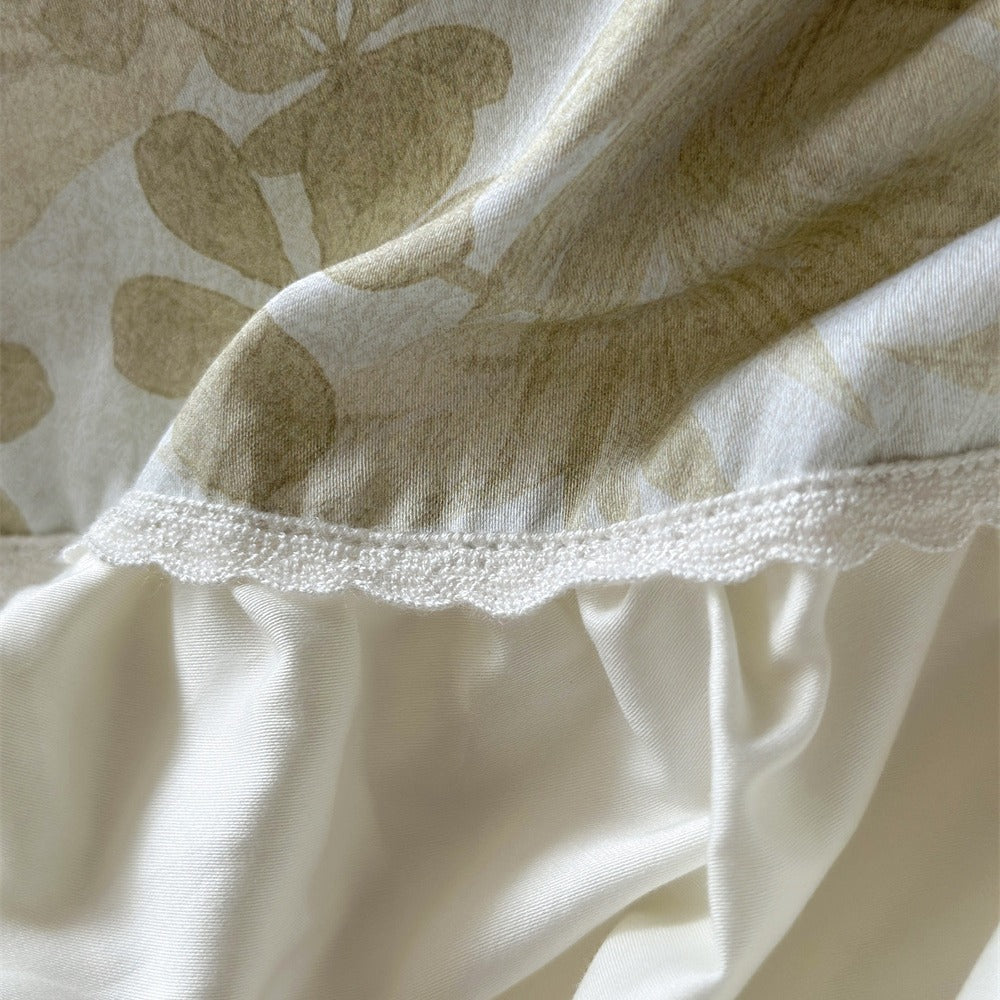 Luxurious jacquard bedding set with ruffled frill, satin trim, and decorative pillows