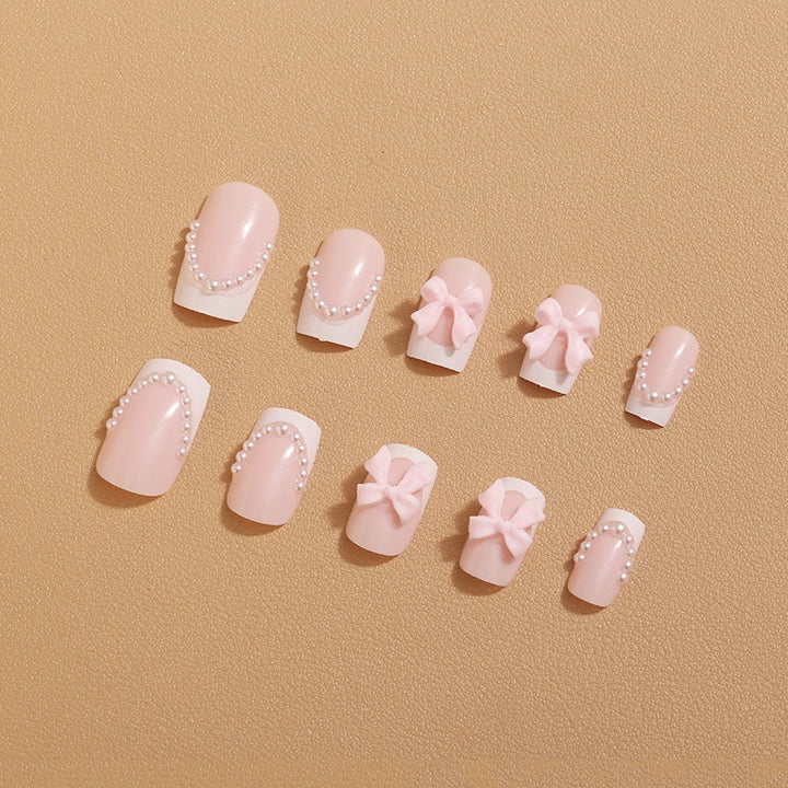 Artificial nail tips with elegant bows and pearl decorations Kalsten