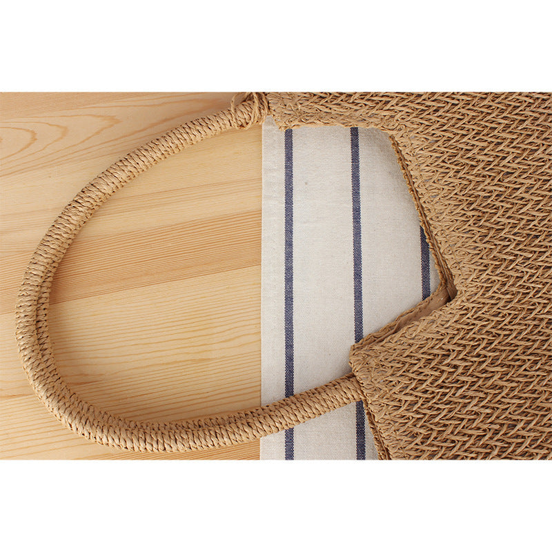Fashionable beach tote bag made of woven natural material with fringed detail Kalsten