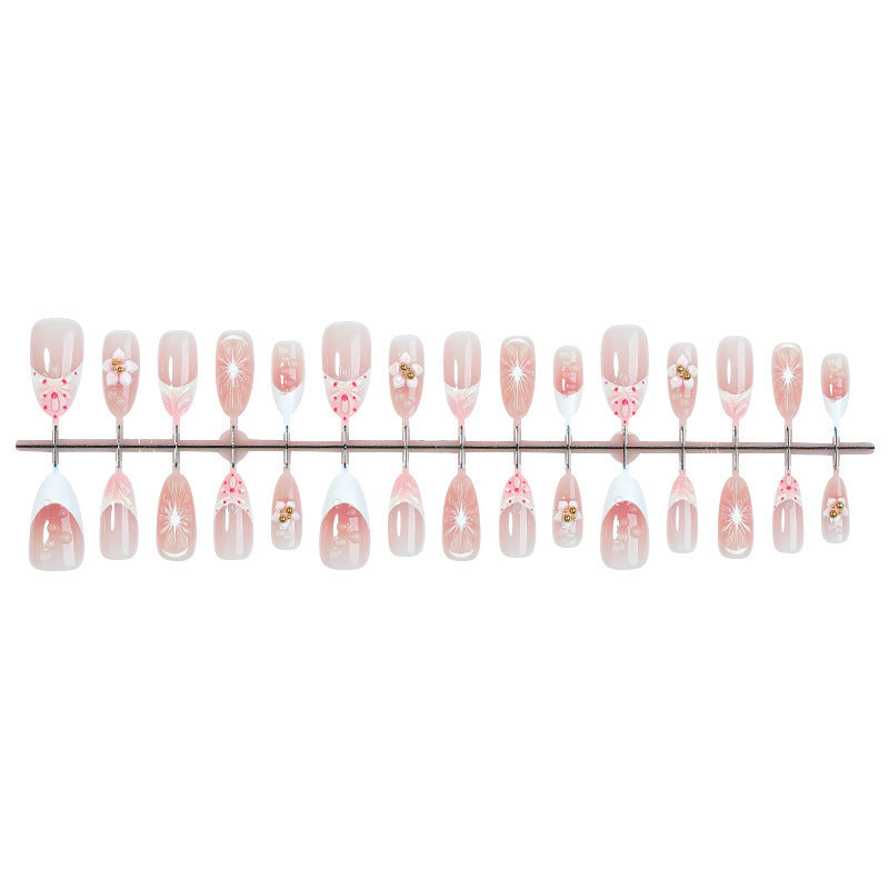 Creative acrylic nail set with floral accents and glitter decorations Kalsten