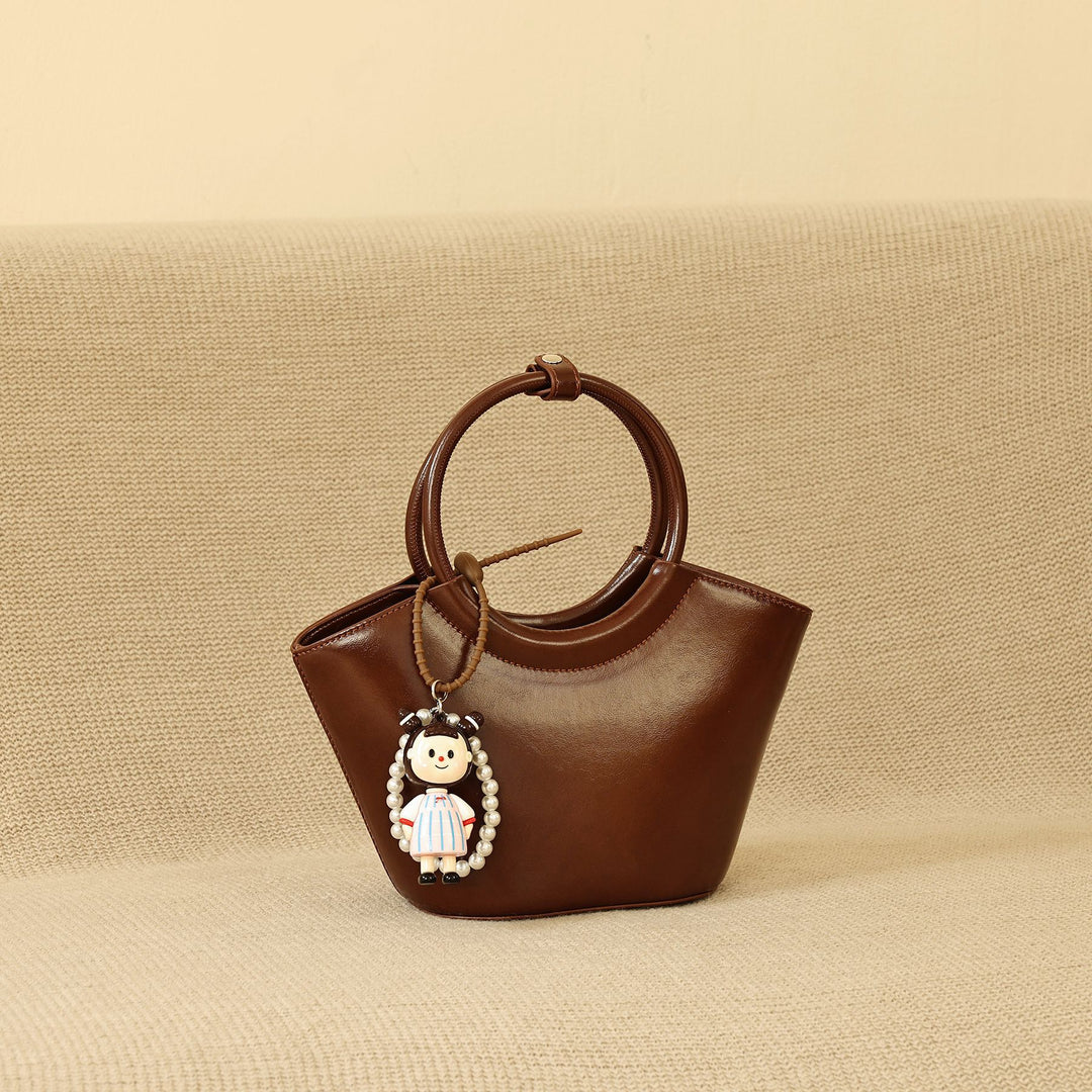 Chic Structured Handbag with Decorative Charm