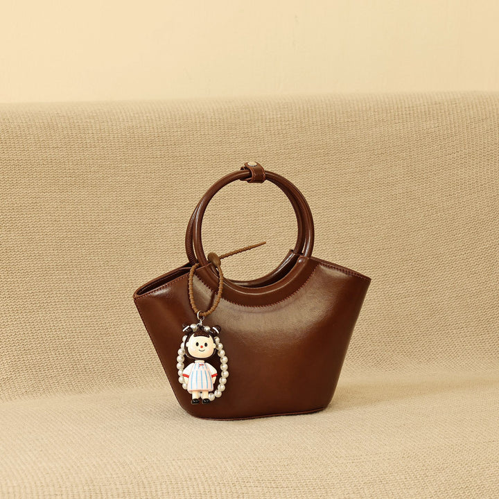 Chic Structured Handbag with Decorative Charm