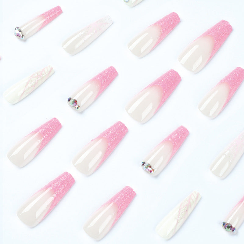 Artistic stiletto nails with glitter and snowflake design Kalsten