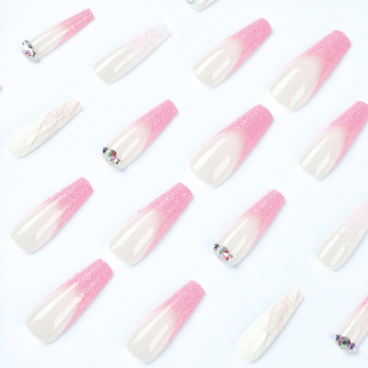 Artistic stiletto nails with glitter and snowflake design Kalsten