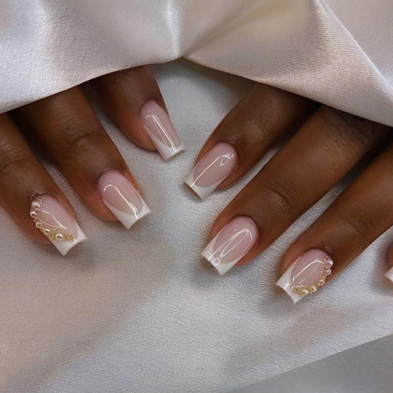 Artificial nail set with elegant French tips and glitter accents Kalsten