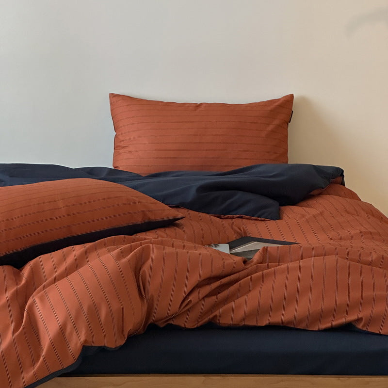 Reversible cotton satin bedding set with fine striped pattern and contrasting backside