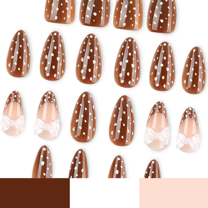 Artistic stiletto nails with delicate bow motif Kalsten