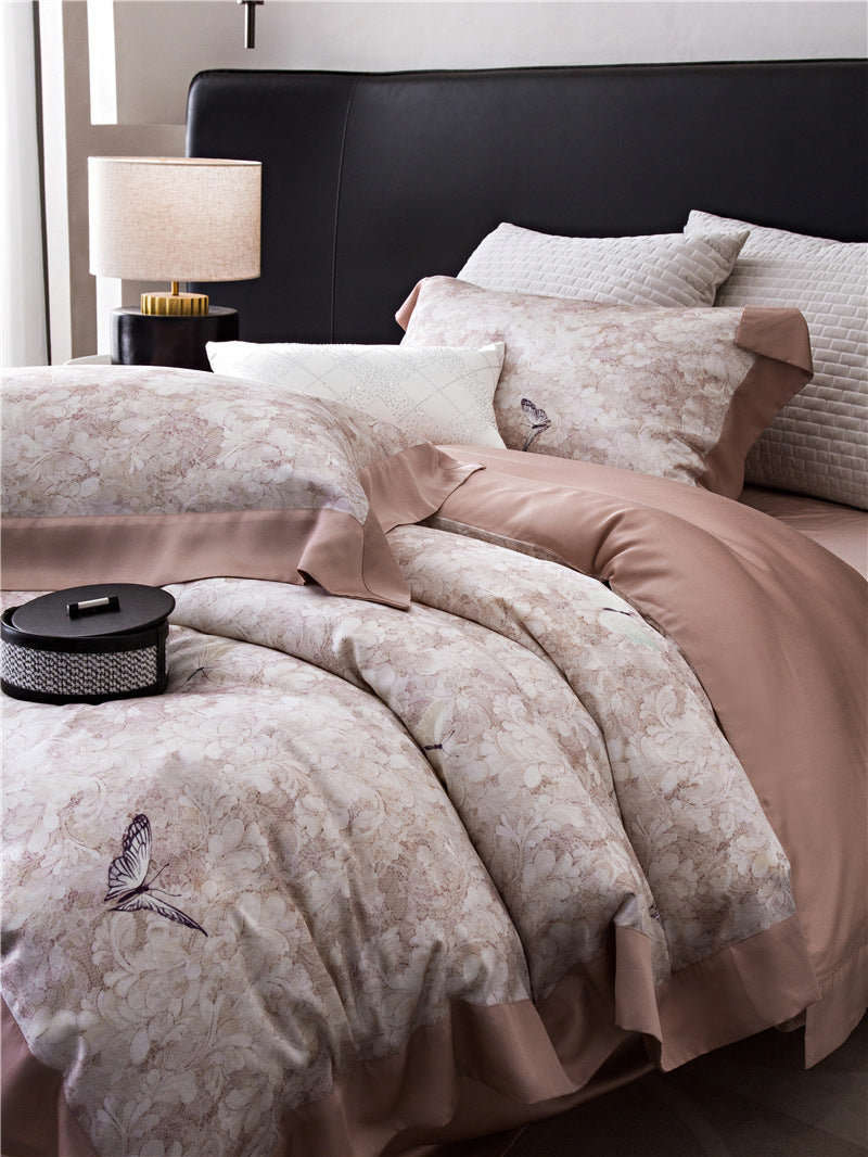Duvet cover set made of cotton satin with subtle watercolor flower print and silky-matte texture