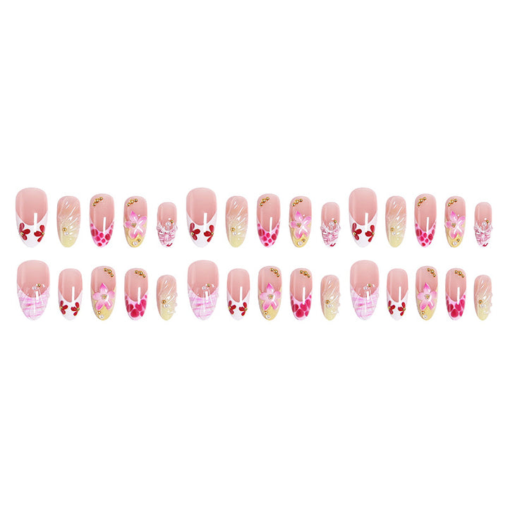 Artificial nails with floral accents and glitter decorations Kalsten