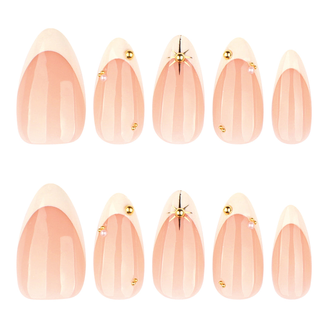 Artistic French-tip nail art with glitter and elegant embellishments Kalsten