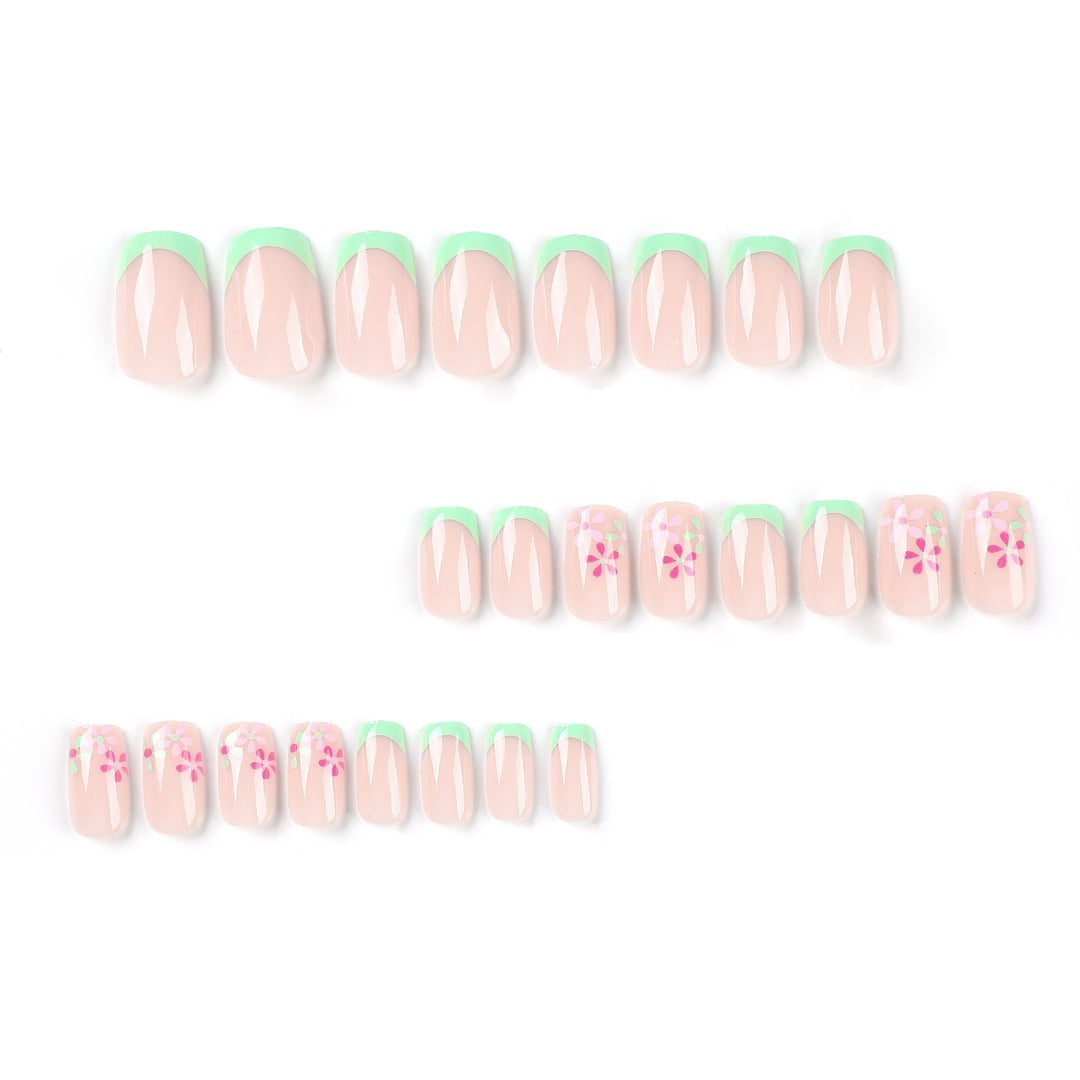 Artificial nails with floral accents and neon tips Kalsten