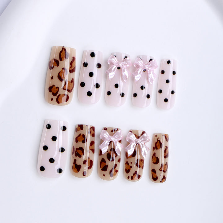 Creative artificial nails with bows and dots Kalsten