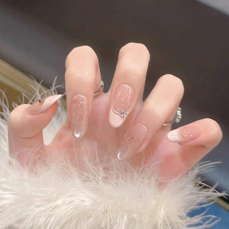 Elegant Press-On Nail Design with Decorative Accents Kalsten