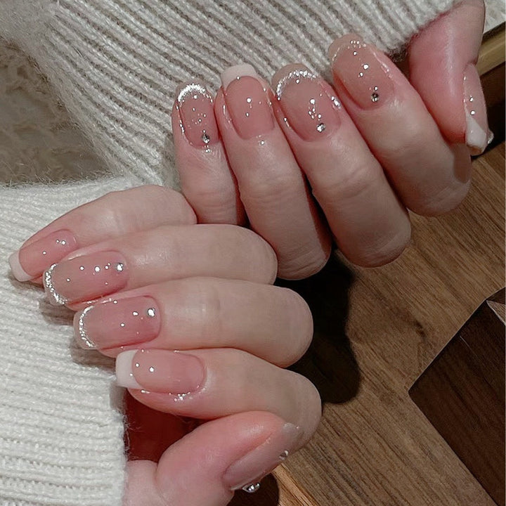 Glamorous artificial nails with filigree rhinestone details Kalsten