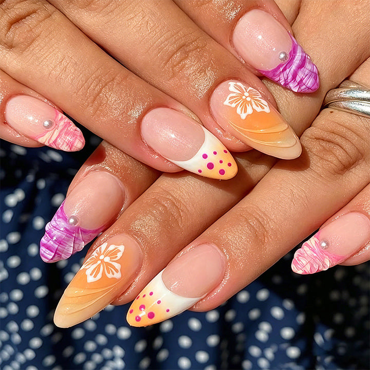 Acrylic nail set with exotic flower patterns and glitter accents Kalsten