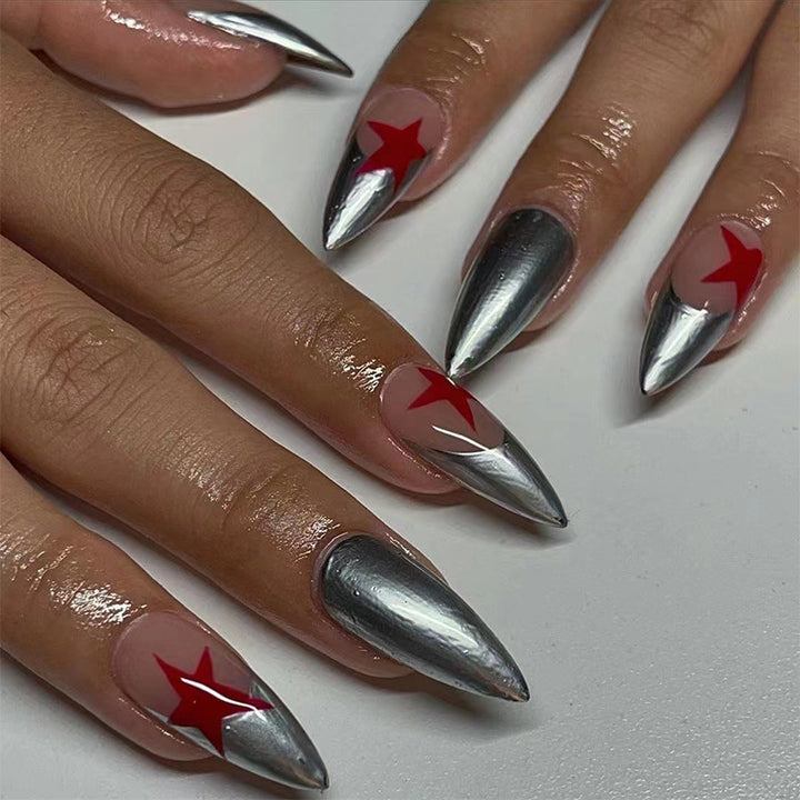 Artful stiletto nails with silver and star motifs Kalsten