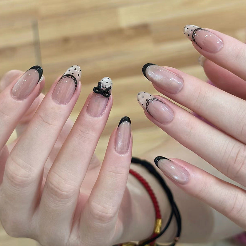 Artistic French Tip Nail Design with Bow Embellishments Kalsten