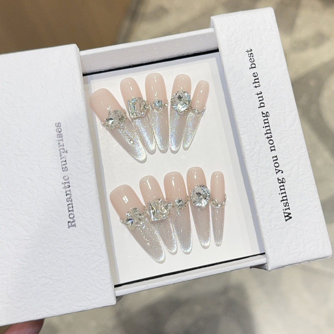 Glamorous artificial nails with sparkling rhinestone embellishments Kalsten