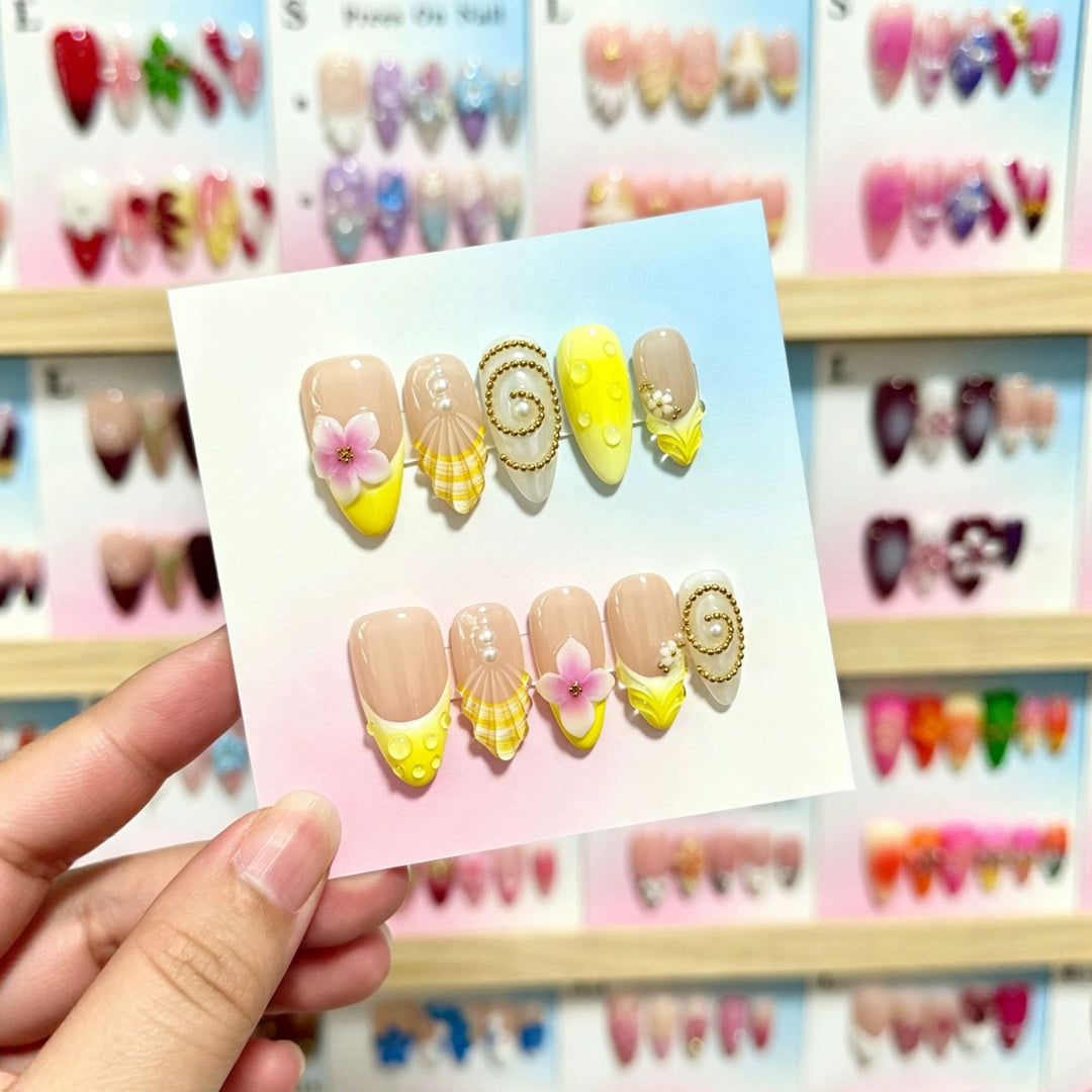 Artistic Press-On Nail Art Set with Floral and Shell Accents