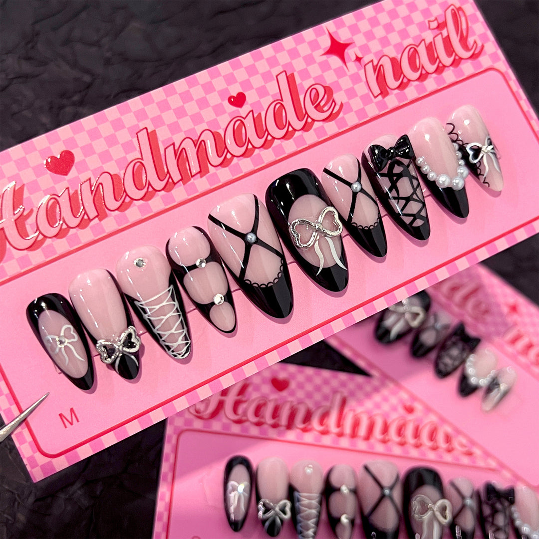 Artful nail art with elegant bows and glitter accents Kalsten