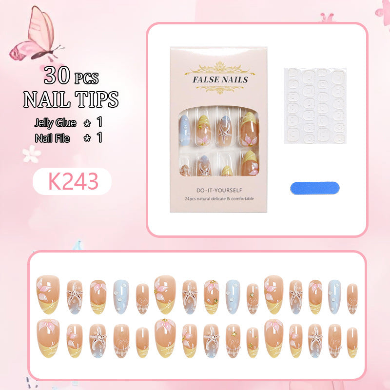 Artificial nail set with floral motifs and glitter accents Kalsten