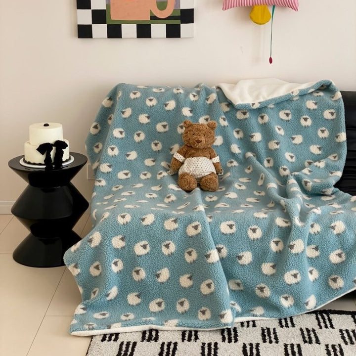 Plush Sherpa throw blanket with abstract pattern and extra-soft teddy fleece