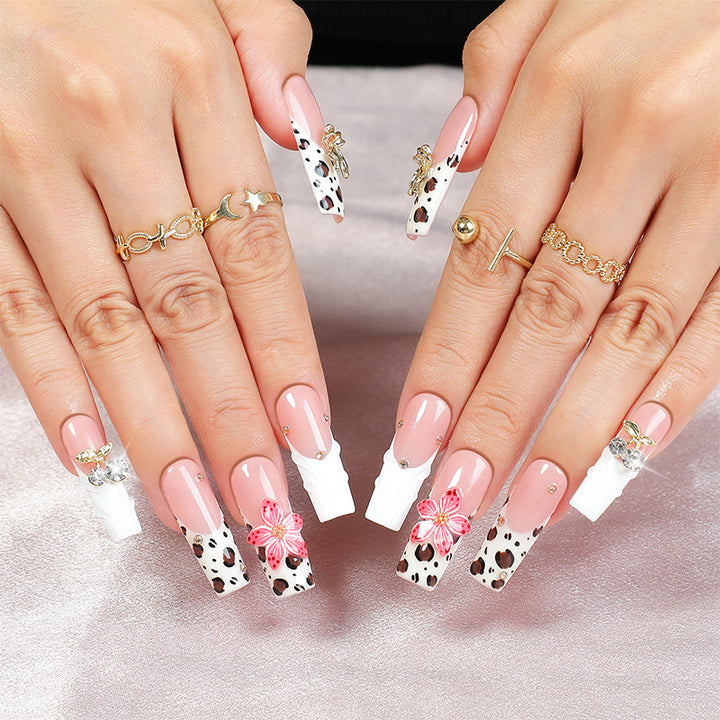 Acrylic nail set with elegant leopard design and floral accents Kalsten