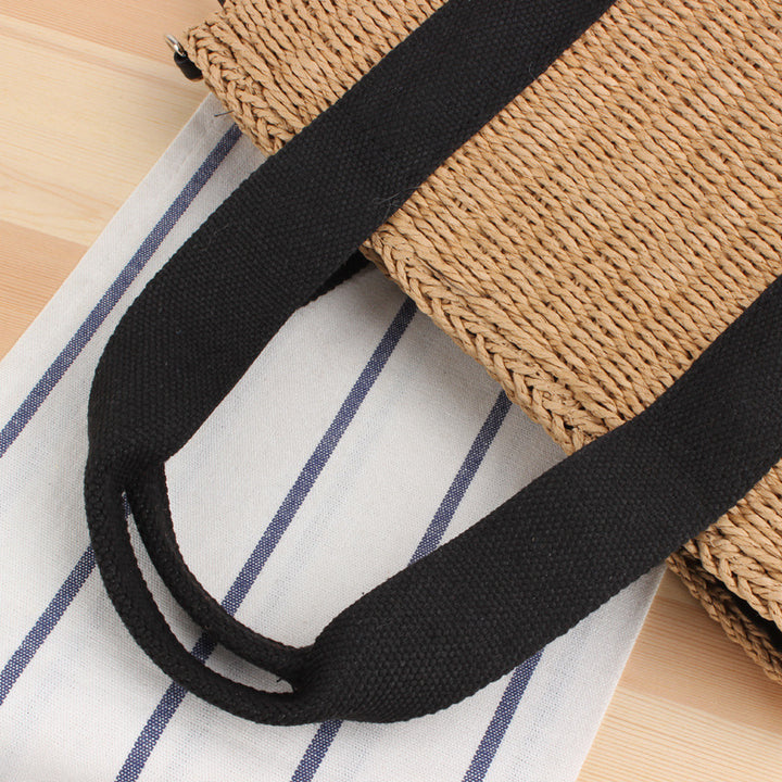 Handbag made of braided natural material with adjustable shoulder strap Kalsten
