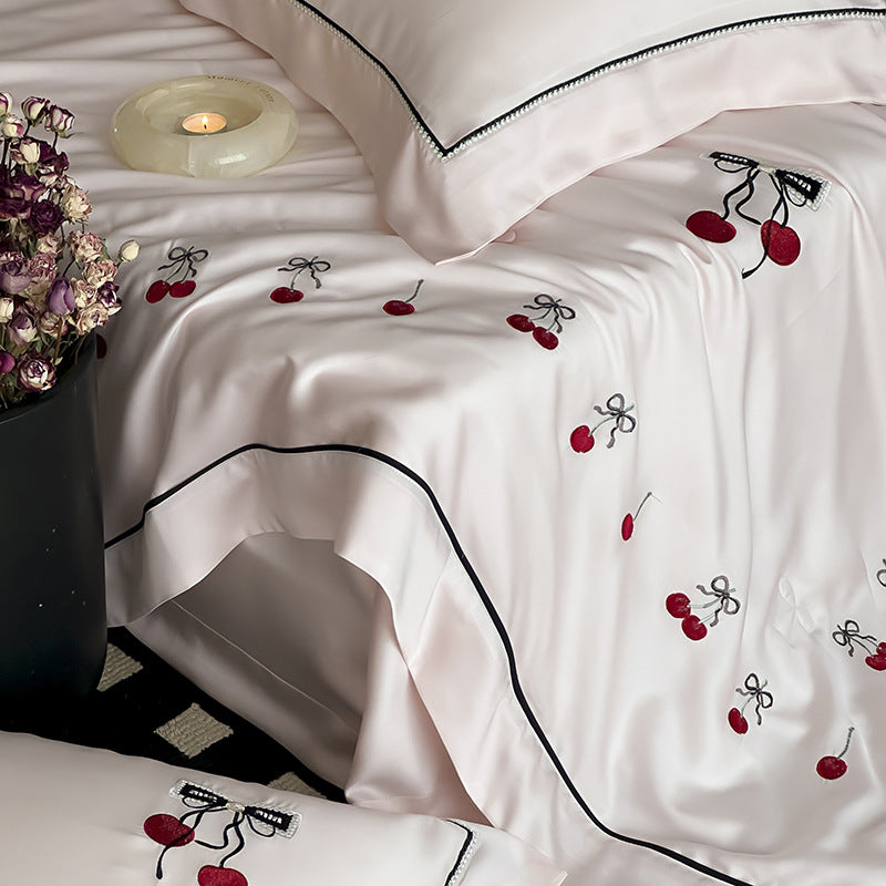 Cotton satin bedding set with cherry embroidery and contrasting piping