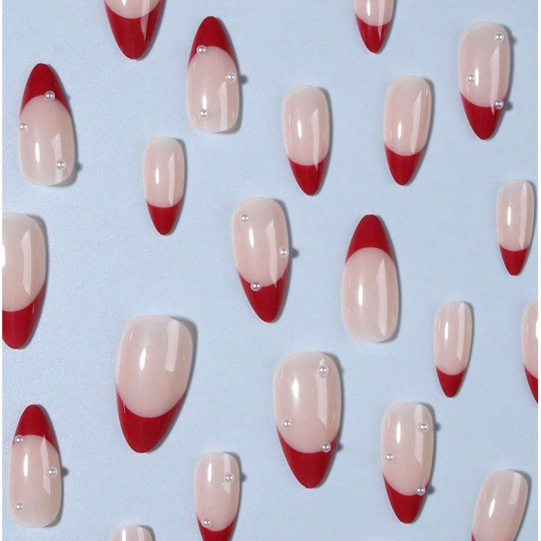 Acrylic nail set with elegant spike design and shimmering accents Kalsten