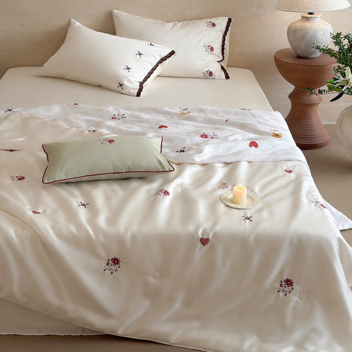 Elegant satin bedding set with fine floral embroidery and lace trim