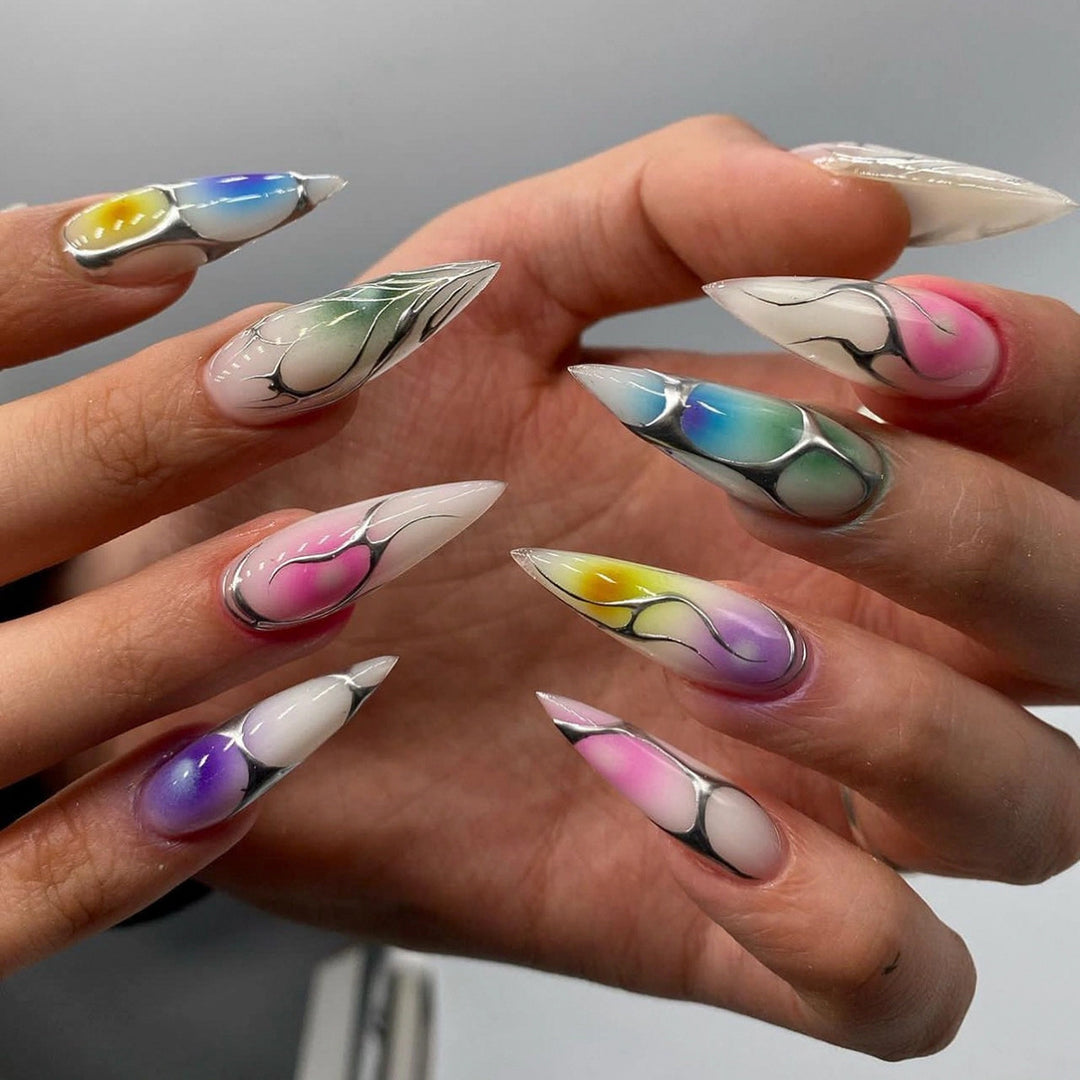 Artful stiletto nails with transparent design and colorful accents Kalsten