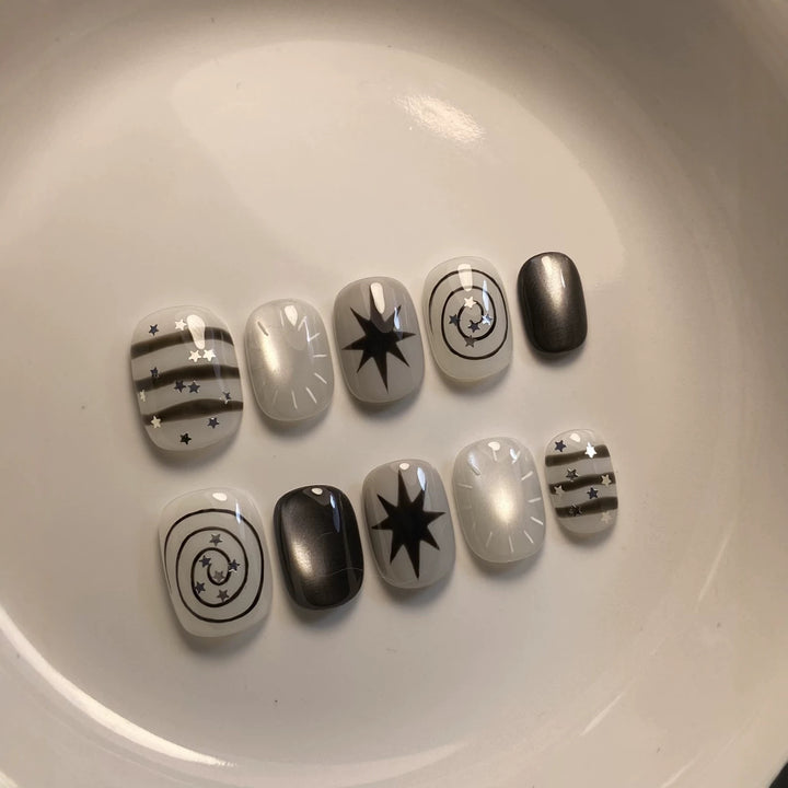 Artistic Press-On Nail Art Set with Celestial Designs