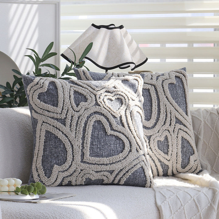 Square cushion cover with three-dimensional looped heart relief made of soft bouclé mix Kalsten